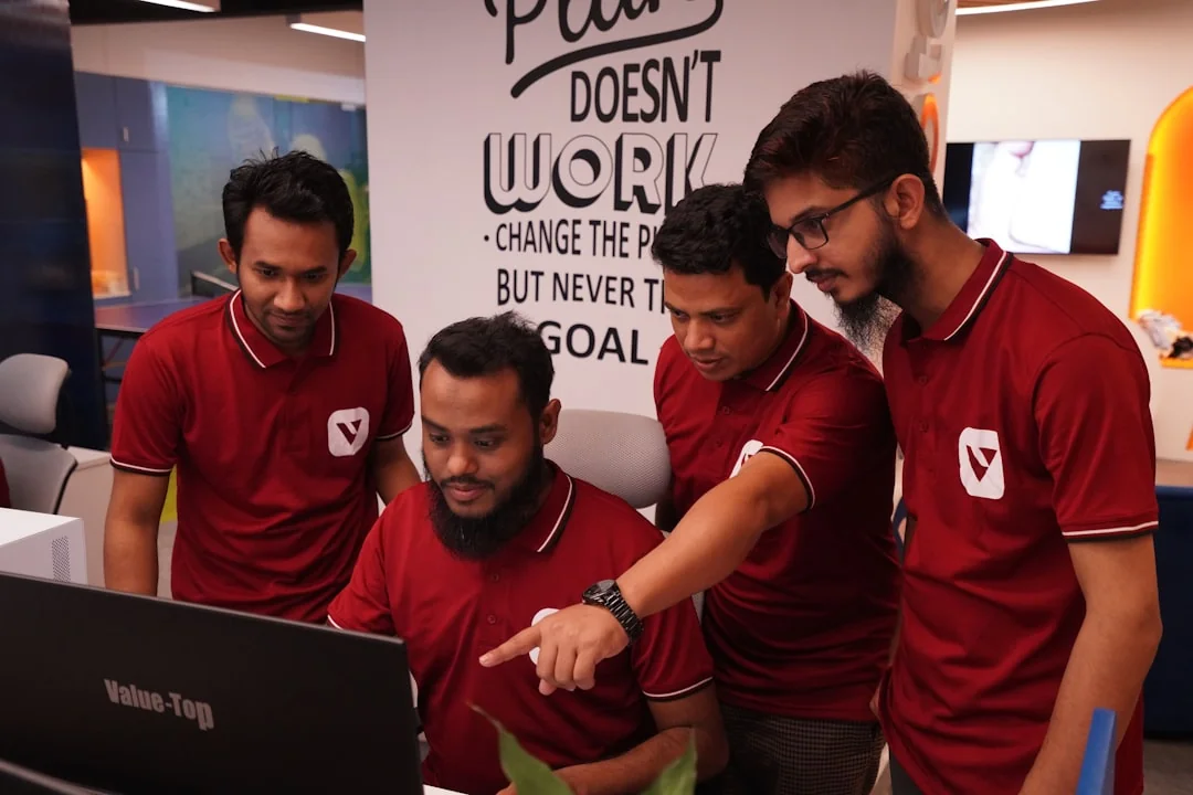 Group of business professionals collaborating in an office setting.